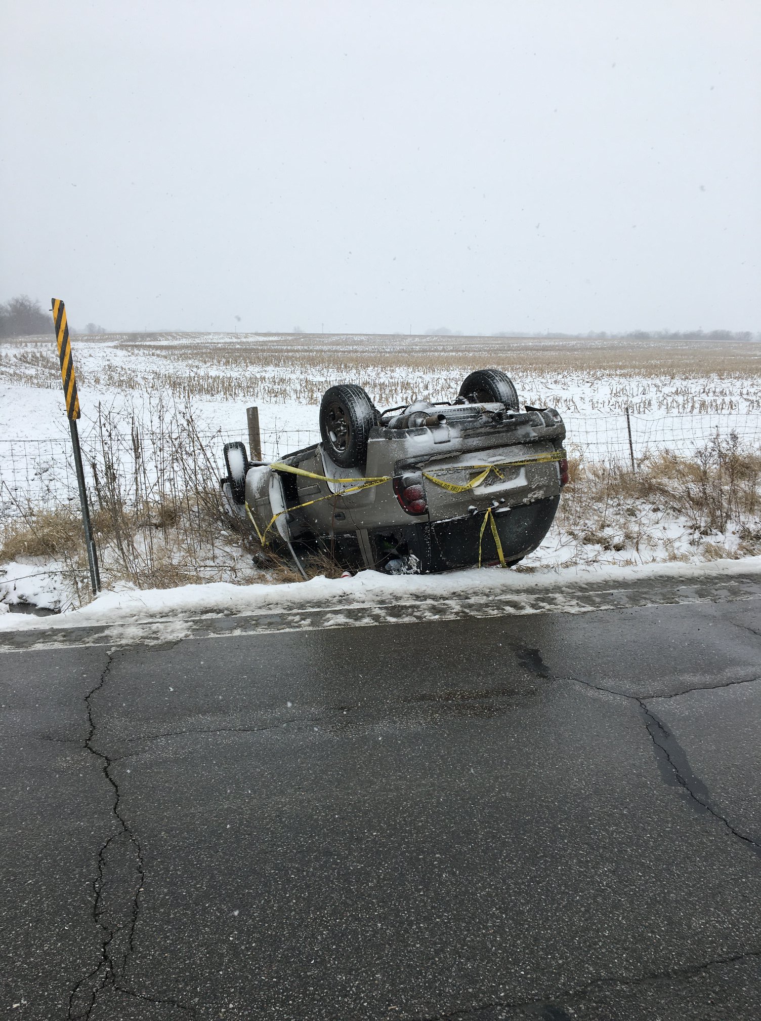 Image of a flipped car.